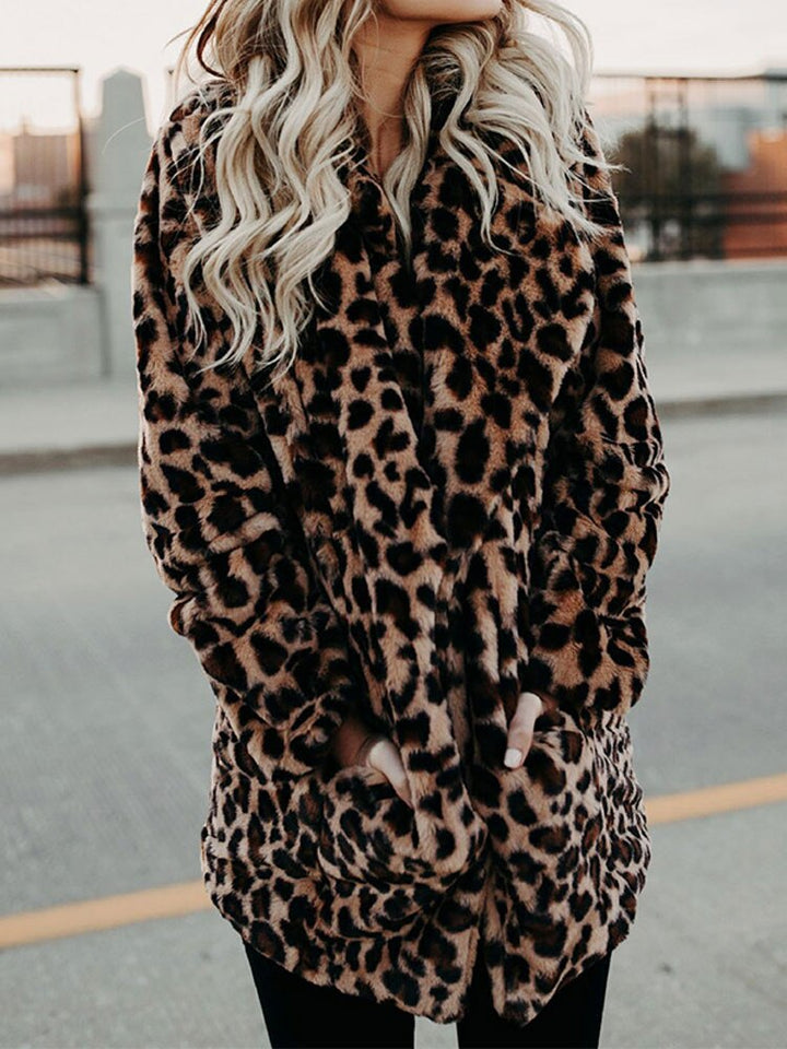 Chic women's leopard print winter coat, Sofia style. Warm, fashionable outerwear for a bold winter look.