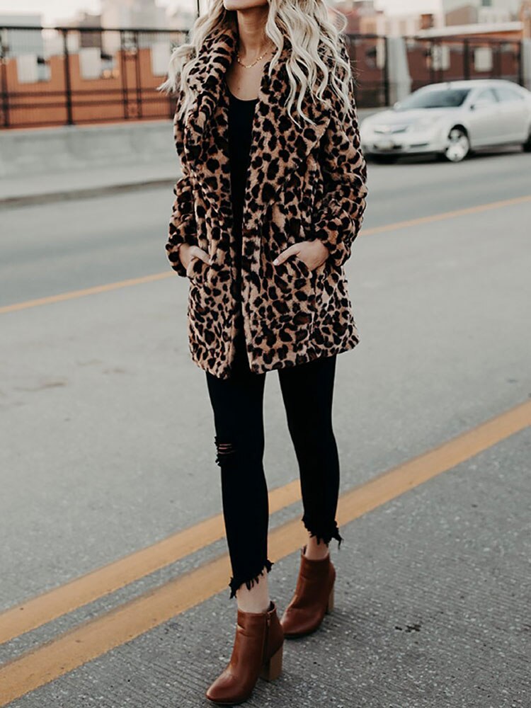 Trendy Sofia women's leopard print winter coat. Stylish, warm outerwear for a fierce and fashionable winter look.