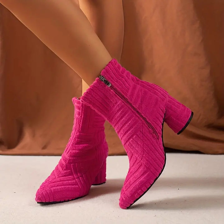 Solid-coloured Selene women's boots featuring a comfortable block heel & chic pointed toe. Stylish zipper footwear.