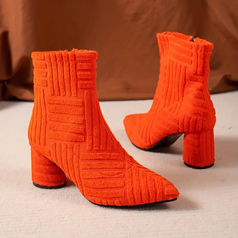 Stylish women's footwear: Selene solid-coloured block heel boots with comfortable pointed toe, perfect for fashion.