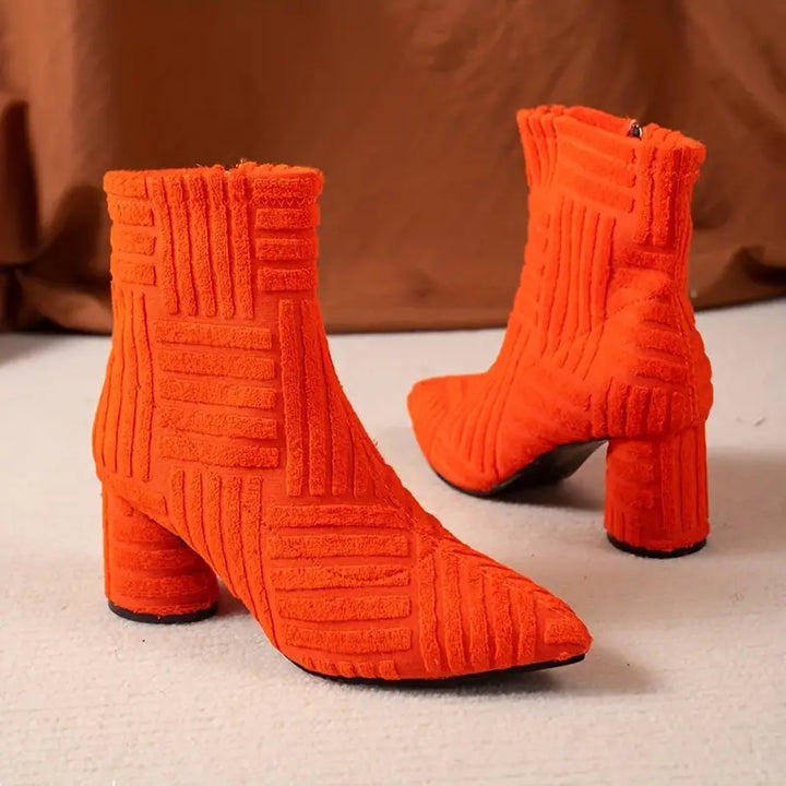 Stylish women's footwear: Selene solid-coloured block heel boots with comfortable pointed toe, perfect for fashion.