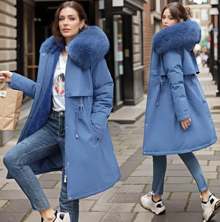 Stylish women's black winter coat. Warm, insulated, & waterproof for cold weather fashion.
