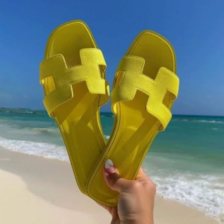 Comfortable women's Cora slip-on sandals, perfect for versatile summer fashion, beachwear, and casual elegant style.