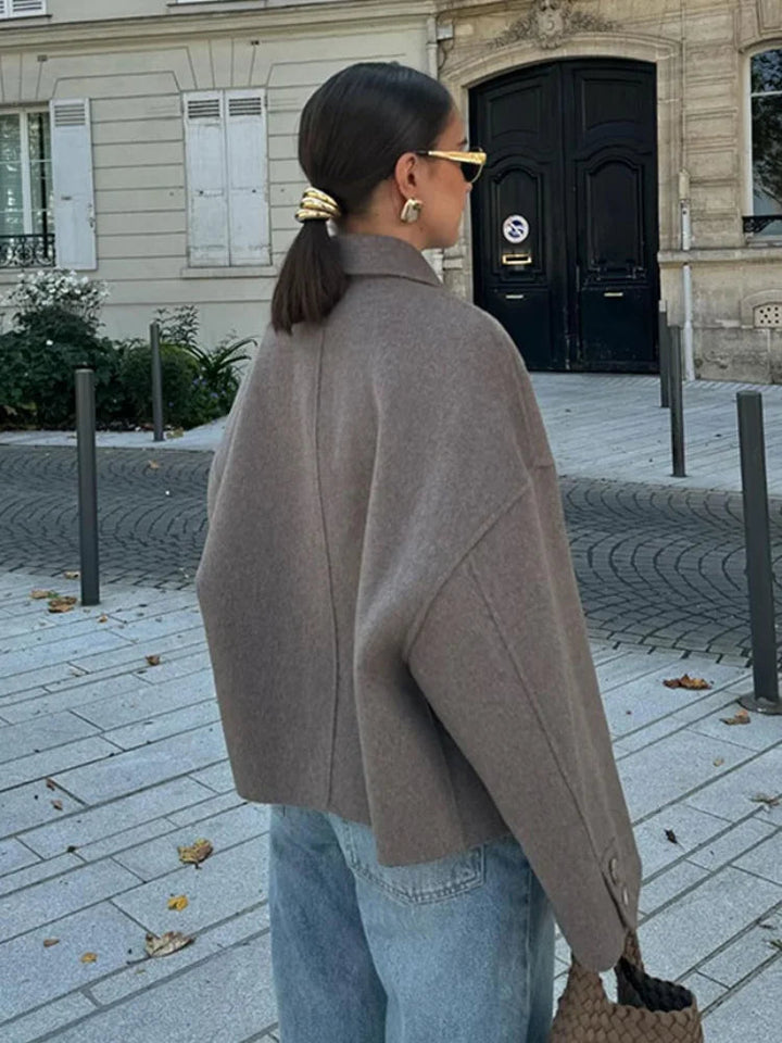 Modern women's cropped boxy jacket. Stylish and warm outerwear, great for layering in fall & winter fashion.