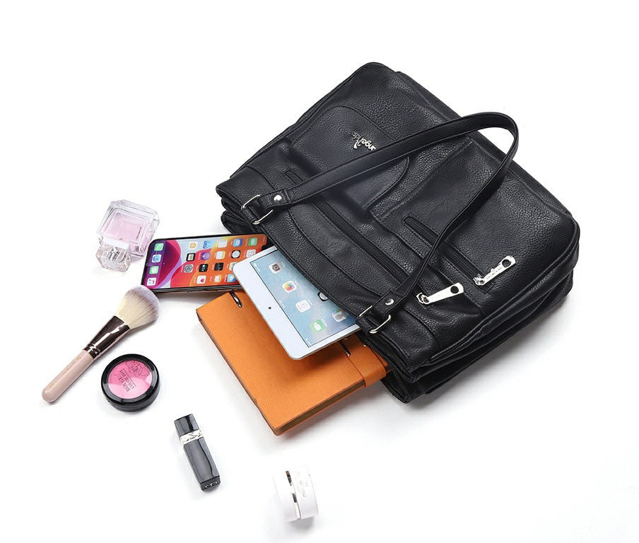 Front view of the FlexiCarry women's multi-compartment PU leather shoulder & crossbody handbag, a stylish accessory.