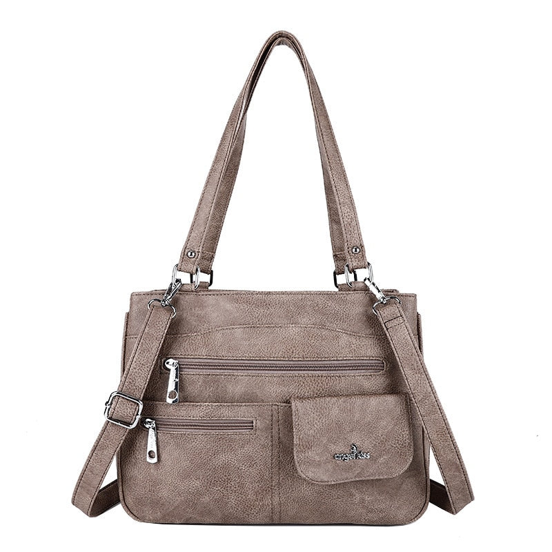 Chic PU leather women's shoulder handbag with multiple compartments, perfect as a versatile everyday fashion accessory.