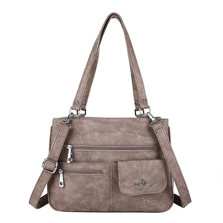 Chic PU leather women's shoulder handbag with multiple compartments, perfect as a versatile everyday fashion accessory.