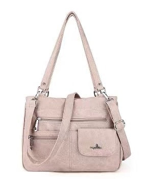 Woman wearing the FlexiCarry multi-compartment PU leather crossbody bag, a stylish and practical everyday accessory.