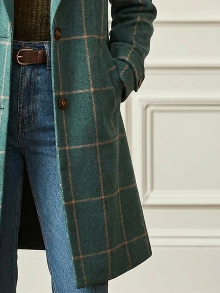 Green checkered long trench coat for women. Features a sophisticated lapel design, excellent for chic winter outerwear.