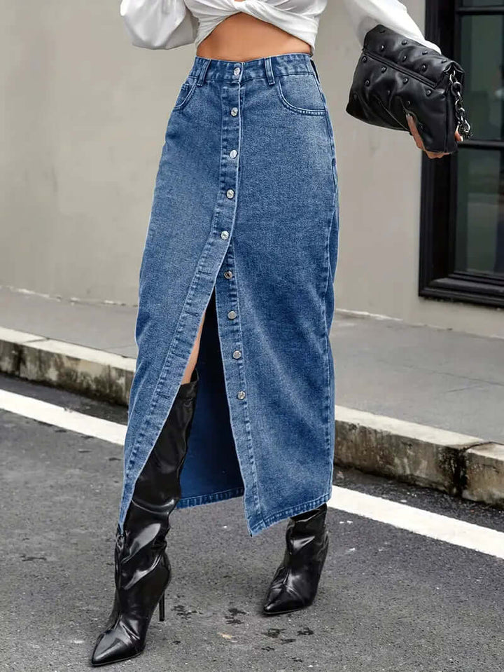 Stylish women's high-waist blue denim midi skirt with a trendy front slit, perfect for casual wear.