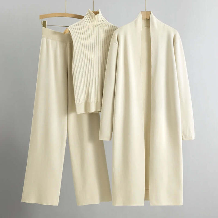 Casual chic 3-piece knitted outfit for women: long cardigan, matching top, and relaxed wide-leg pants.