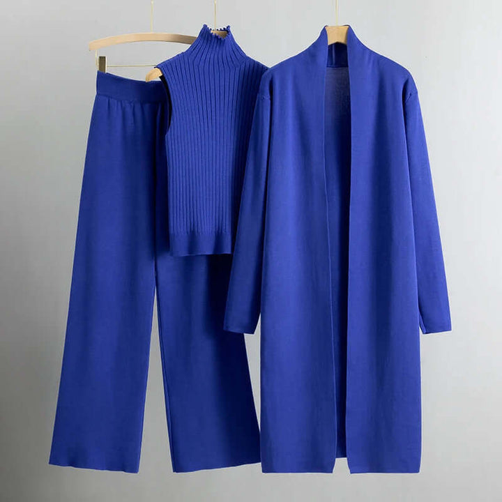 Elegant women's loungewear: a cozy knitted cardigan, top, and wide-leg pants set, ideal for relaxed fashion.
