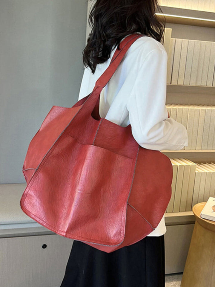 Large women's everyday tote bag, a practical and stylish shoulder accessory for daily needs.