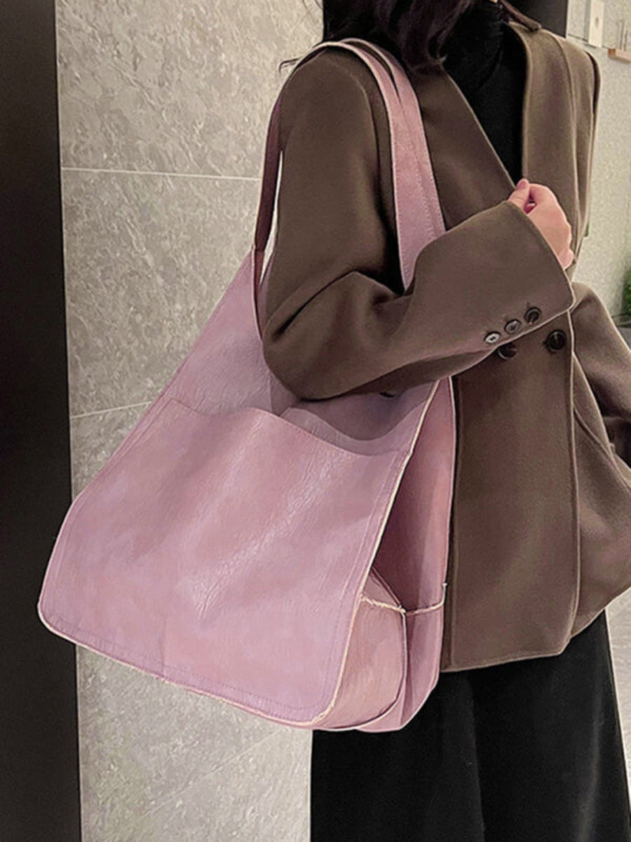 Modern women's large tote bag, a stylish shoulder bag designed for travel and everyday utility.