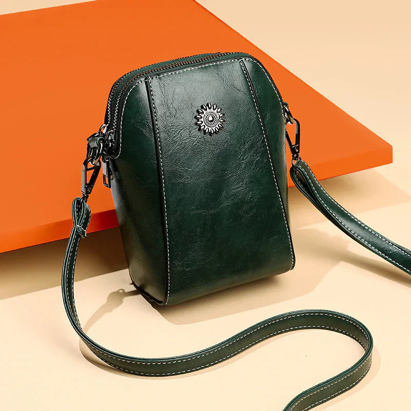 Stylish women's leather shoulder bag with adjustable strap, perfect for daily use & elegant fashion.