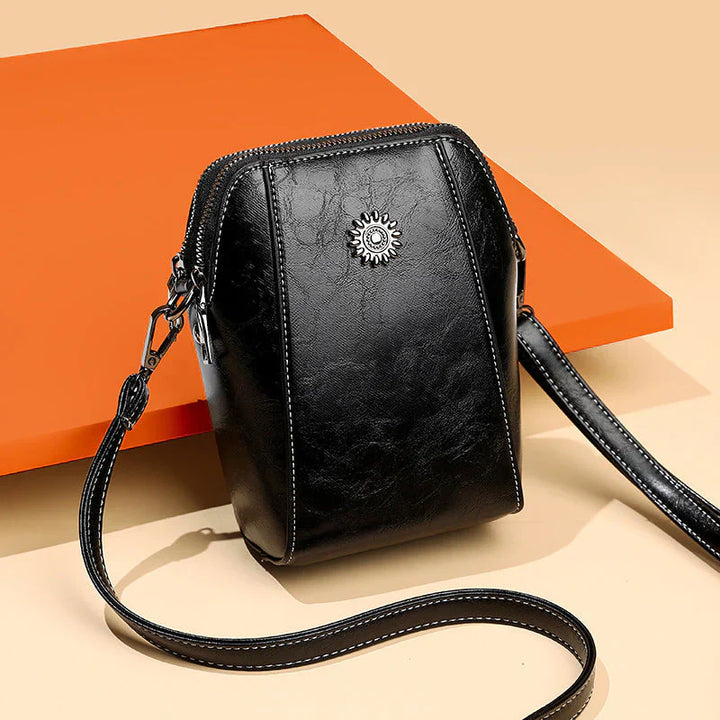Versatile women's leather handbag, a stylish accessory for daily use with an adjustable shoulder strap.