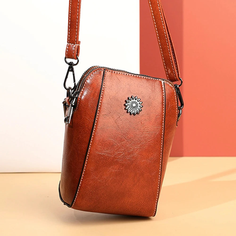 Chic brown leather women's shoulder bag, versatile handbag with an adjustable strap for daily use.