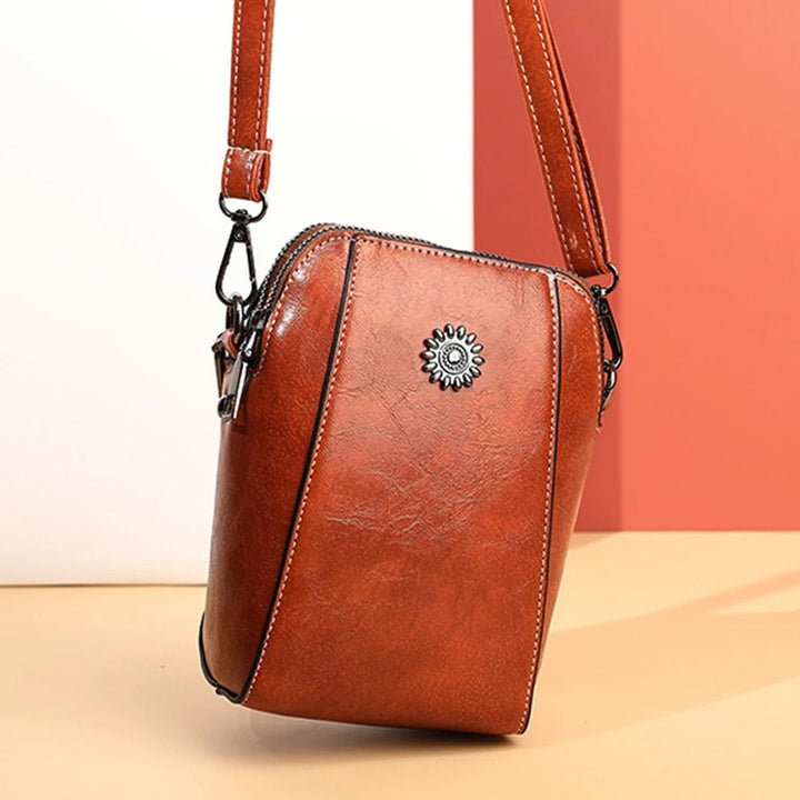Chic brown leather women's shoulder bag, versatile handbag with an adjustable strap for daily use.