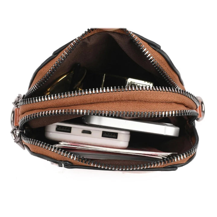 Fashionable women's leather handbag with adjustable shoulder strap, a versatile & stylish accessory.