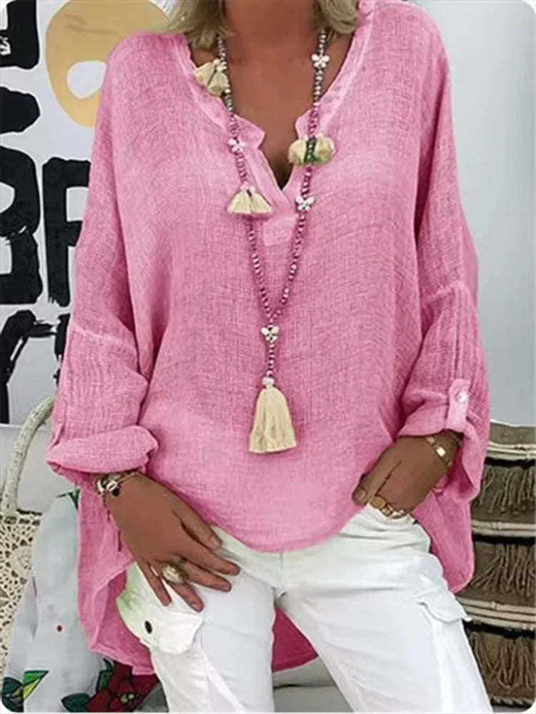 Flowing women's oversized top, a versatile and elegant fashion piece for various occasions.