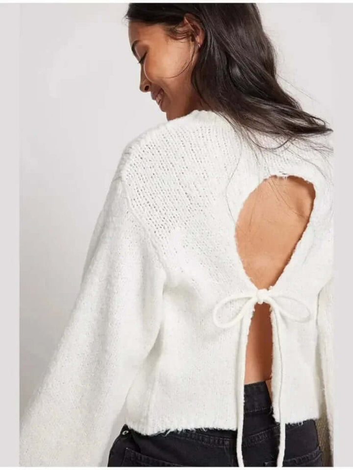 Comfortable polyester long-sleeve crop top for women, featuring a trendy open back design for stylish casual wear.