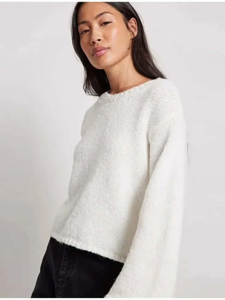 Women's trendy long sleeve crop top with a stylish open back design, comfortable for any casual occasion.