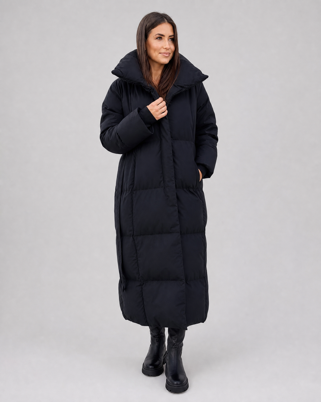 Stylish women's long winter puffer jacket. Cozy & warm, perfect for cold weather and fashionable outerwear.
