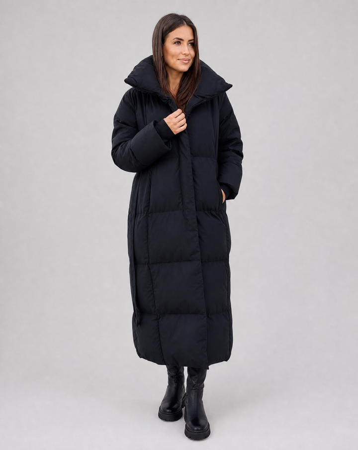 Stylish women's long winter puffer jacket. Cozy & warm, perfect for cold weather and fashionable outerwear.