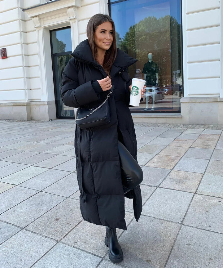 Elegant women's long puffer jacket. Quilted, warm & stylish, ideal for winter fashion and cold weather protection.