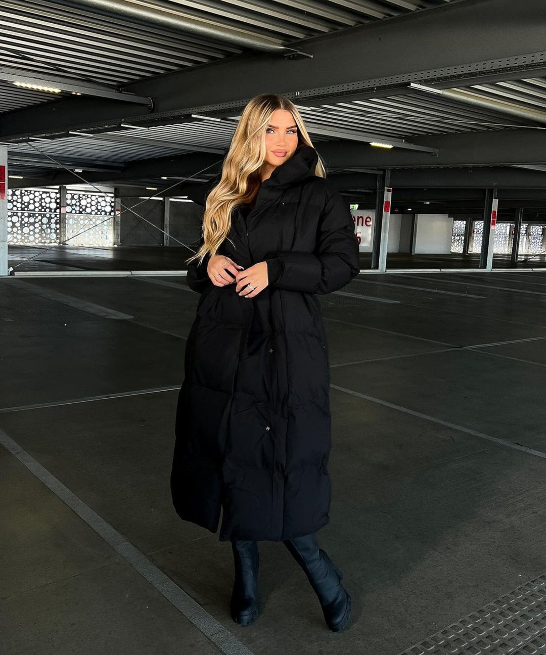 Women's full-length winter puffer jacket. Provides warmth, comfort & style for any cold weather occasion.