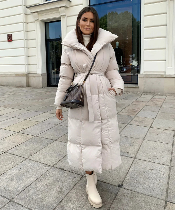 Trendy women's long winter coat. A comfortable and cozy puffer jacket, perfect for stylish cold weather outfits.