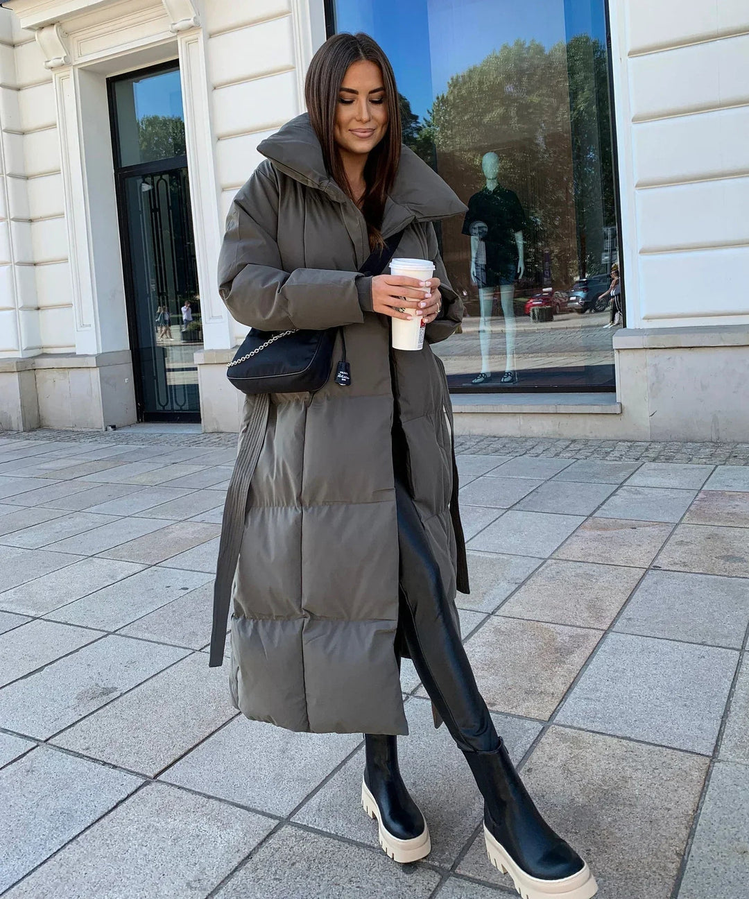 Durable women's long winter puffer jacket. Offering cozy warmth and style for cold weather adventures.