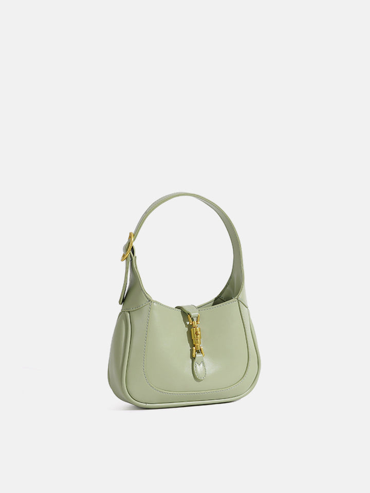 Chic green mini shoulder bag for women, an elegant and compact accessory.