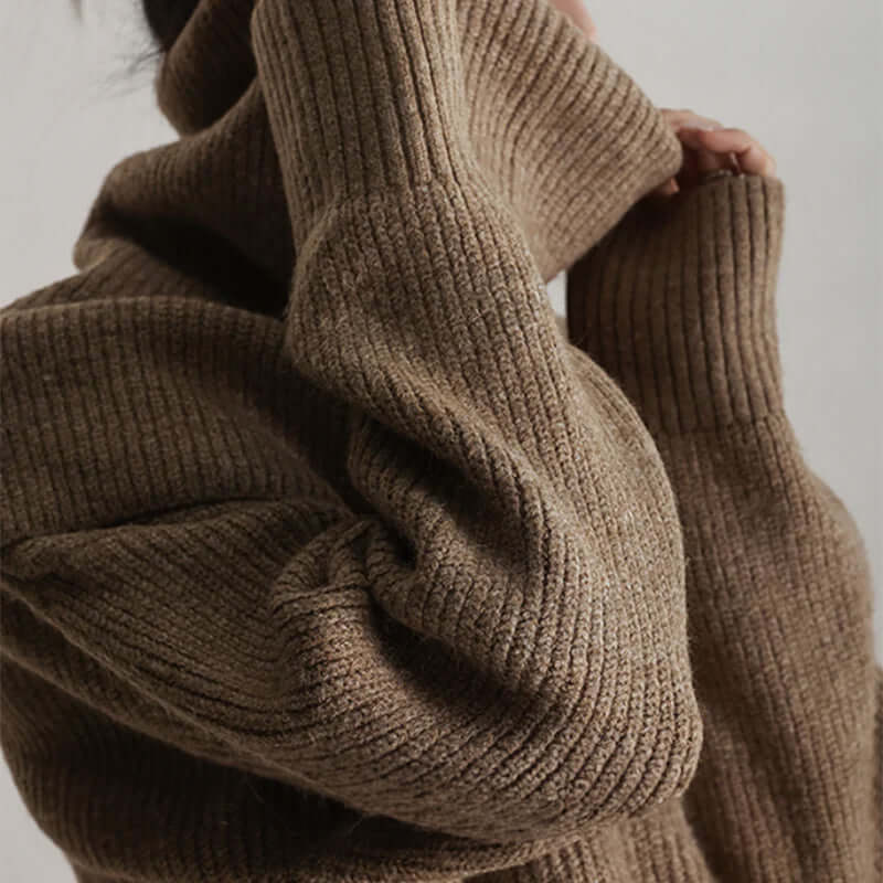 Modern women's oversized turtleneck knit sweater, combining cozy warmth with effortless style.