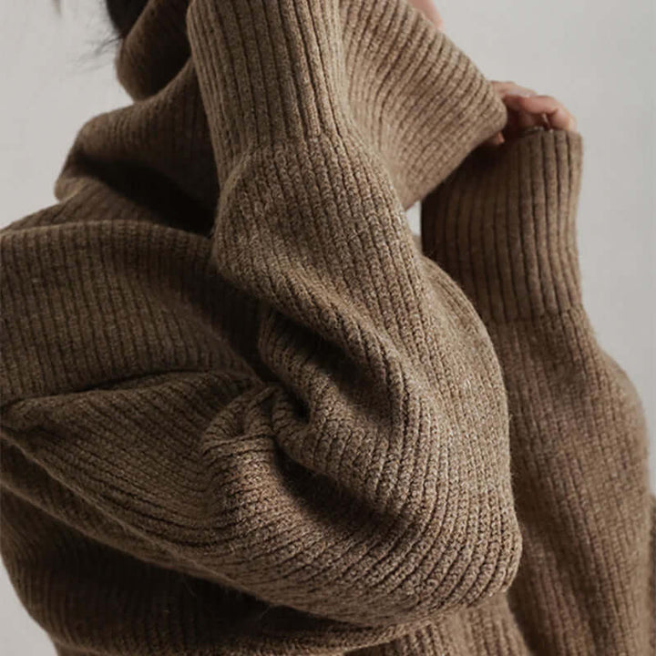 Modern women's oversized turtleneck knit sweater, combining cozy warmth with effortless style.