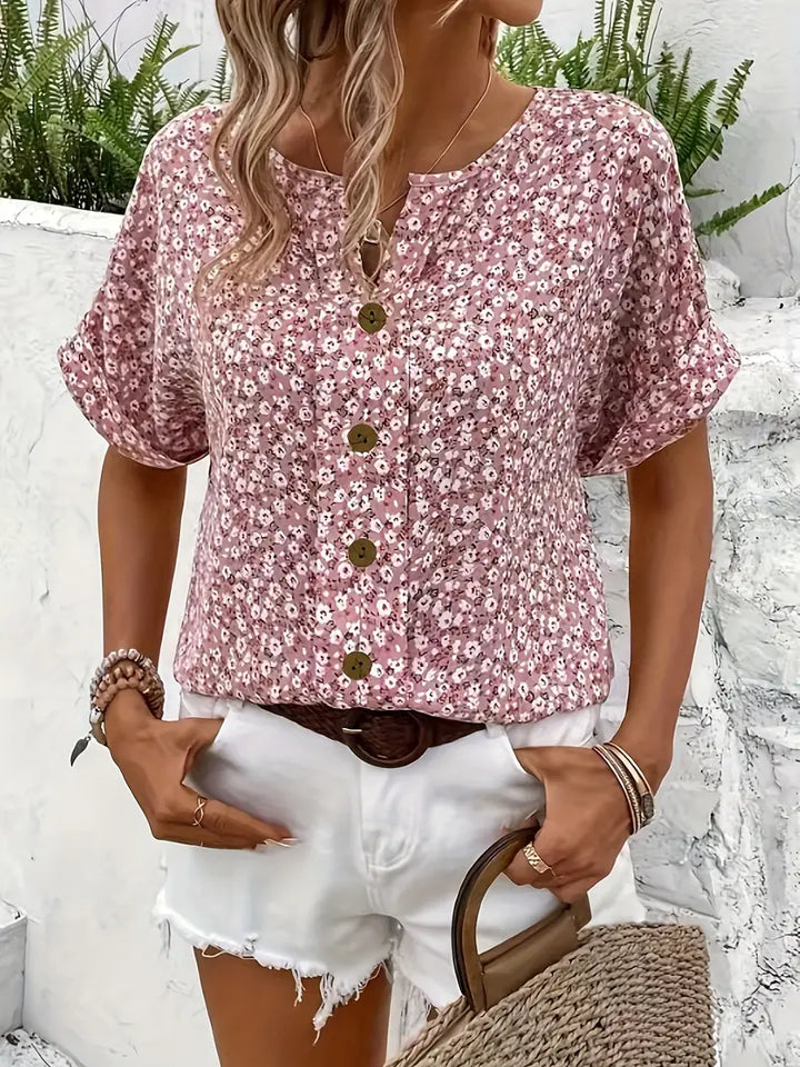 Comfortable women's short-sleeve floral button-front top, a versatile and stylish addition to your spring wardrobe.