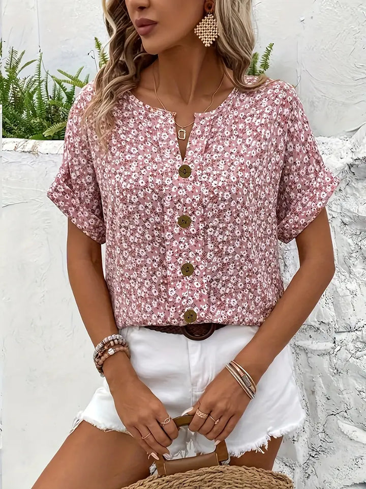 Women's pink floral short sleeve blouse, a chic button-front shirt ideal for casual wear & elegant summer looks.