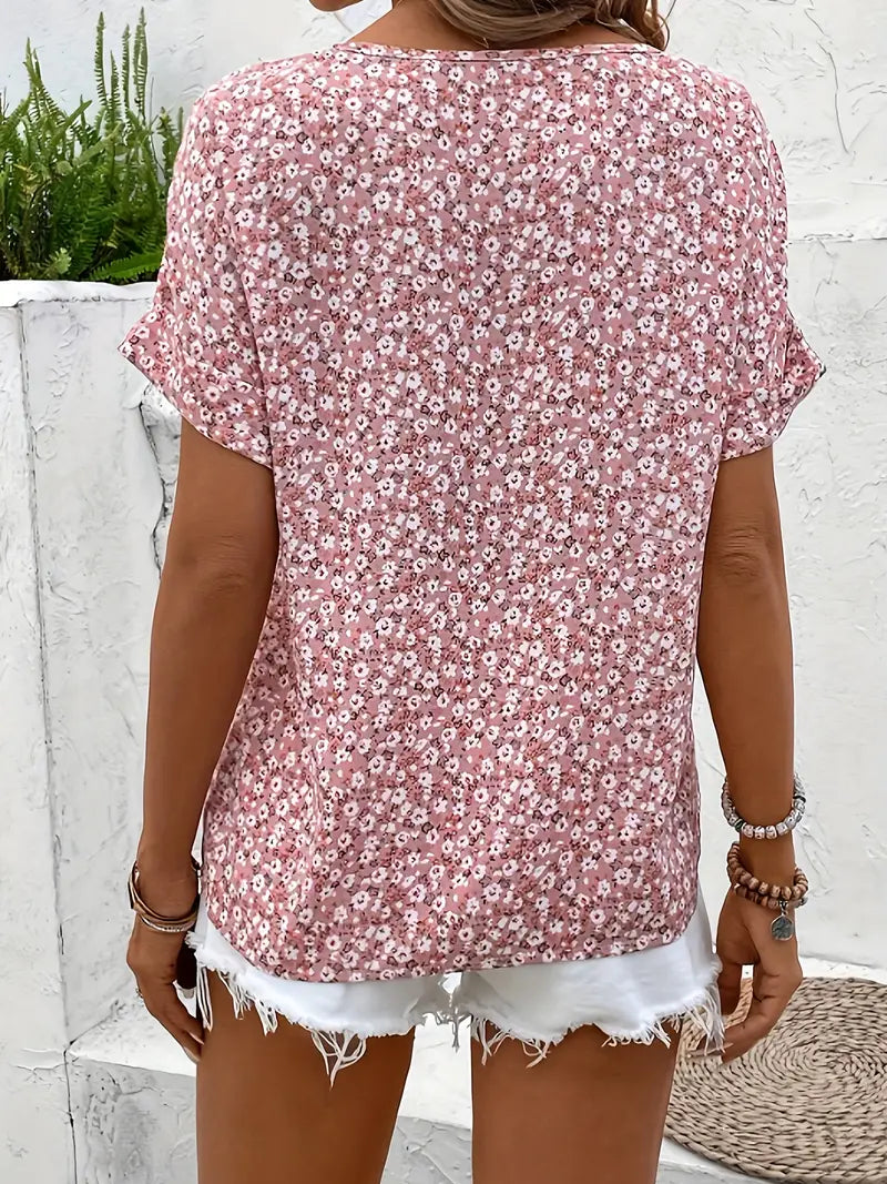 Full view of a comfortable women's floral button-front blouse, a stylish short sleeve top for spring and summer.