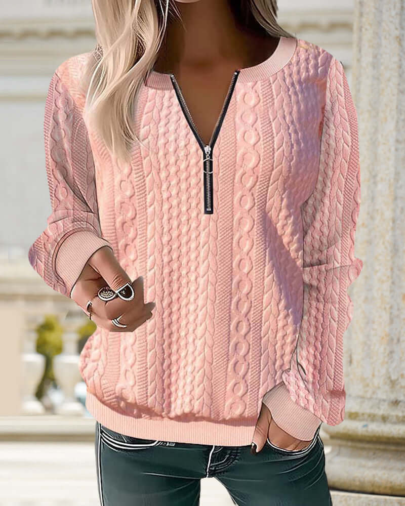 Comfortable gray half-zip knitted pullover sweater for women. Warm, casual layering for winter wear.