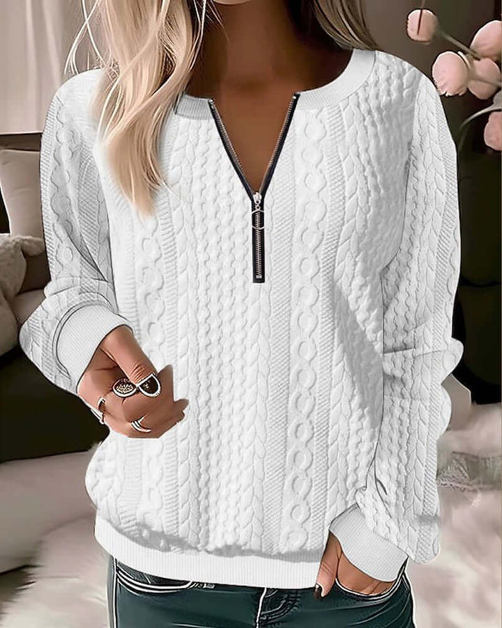 Model wearing a stylish women's knitted half-zip pullover. Warm & cozy, great for casual winter layering.