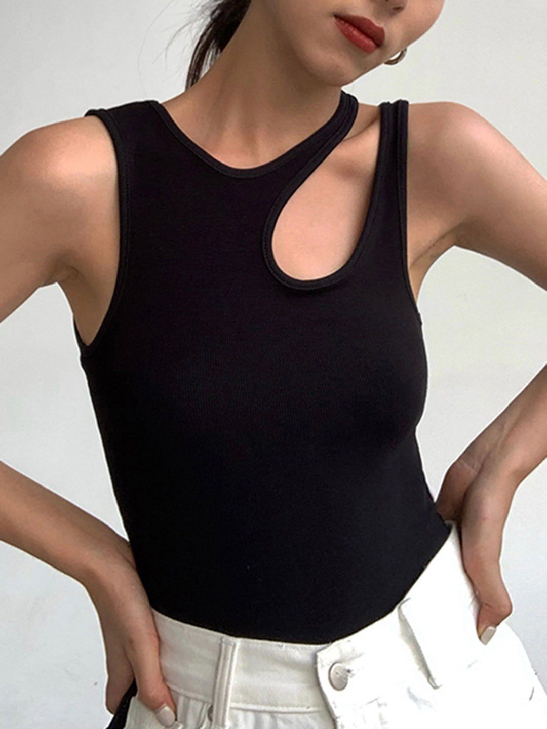 Trendy women's ribbed cutout tank top in a solid color, a versatile sleeveless piece for any look.