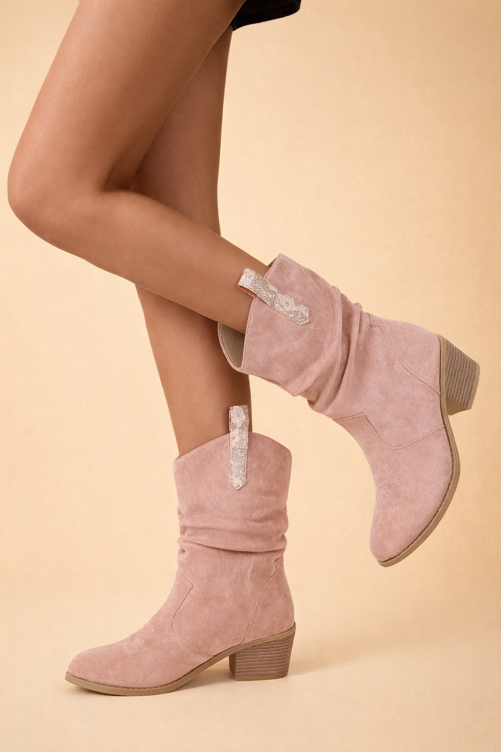 Chic women's comfortable slip-on boots with a block heel in pink, ideal for versatile everyday style.