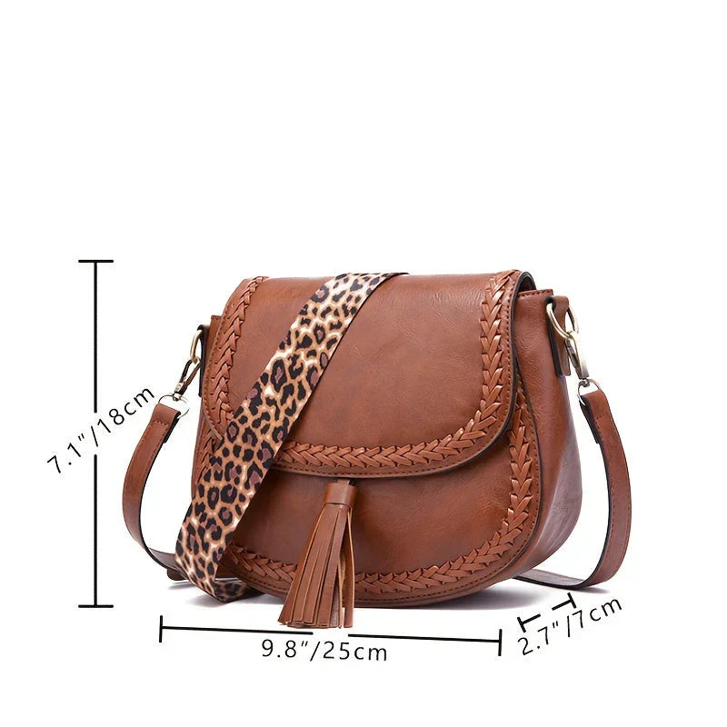 Brown women's small shoulder bag, faux leather with a fashionable tassel, an essential stylish everyday accessory.