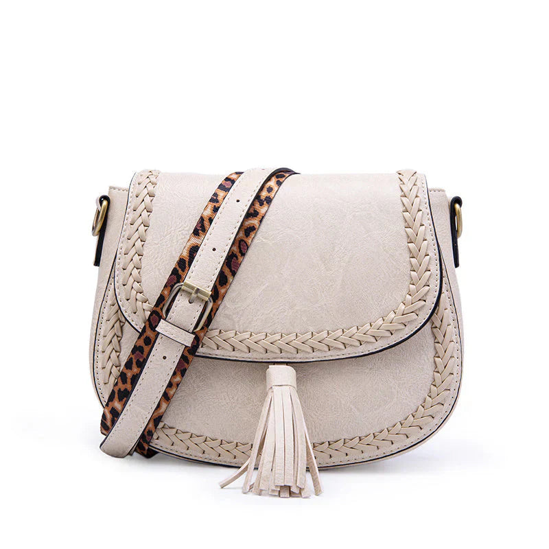 High-quality faux leather small shoulder bag for women, stylish design with tassel, a versatile fashion item.