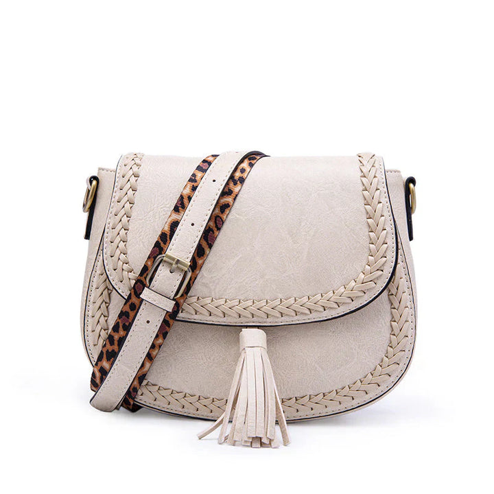 High-quality faux leather small shoulder bag for women, stylish design with tassel, a versatile fashion item.