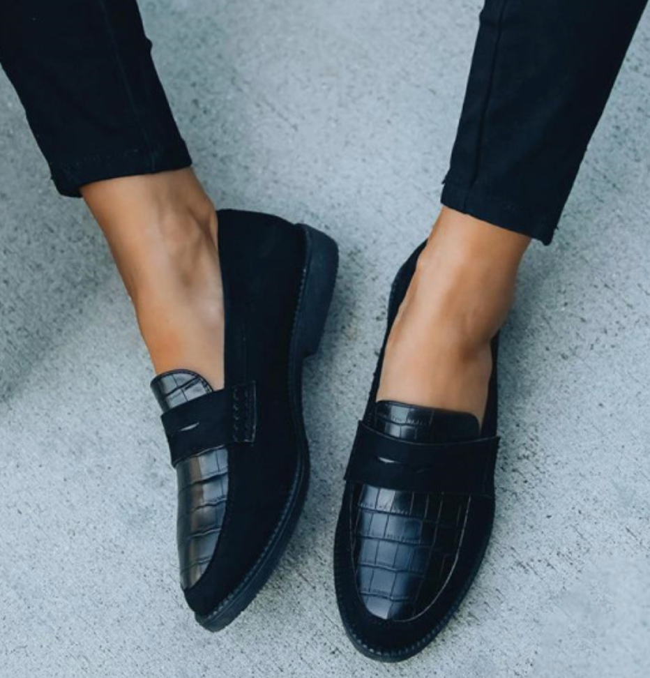 Close-up of comfortable women's summer footwear, highlighting soft straps and cushioned sole for all-day comfort.