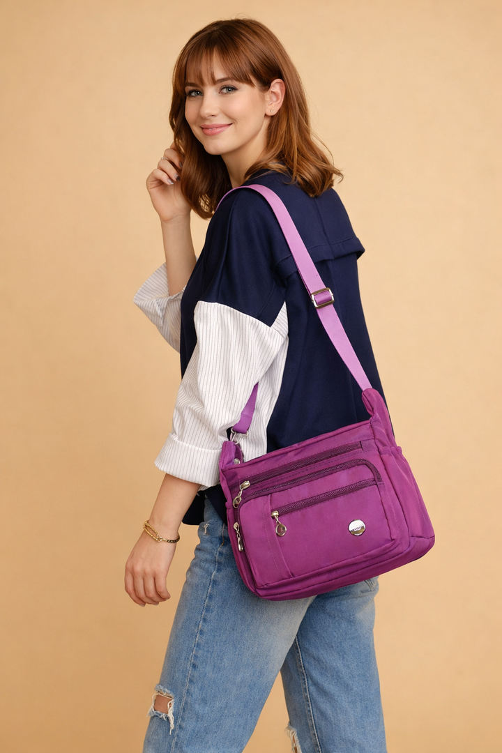 Women's stylish and practical travel crossbody shoulder bag, featuring multiple pockets for optimal organization.