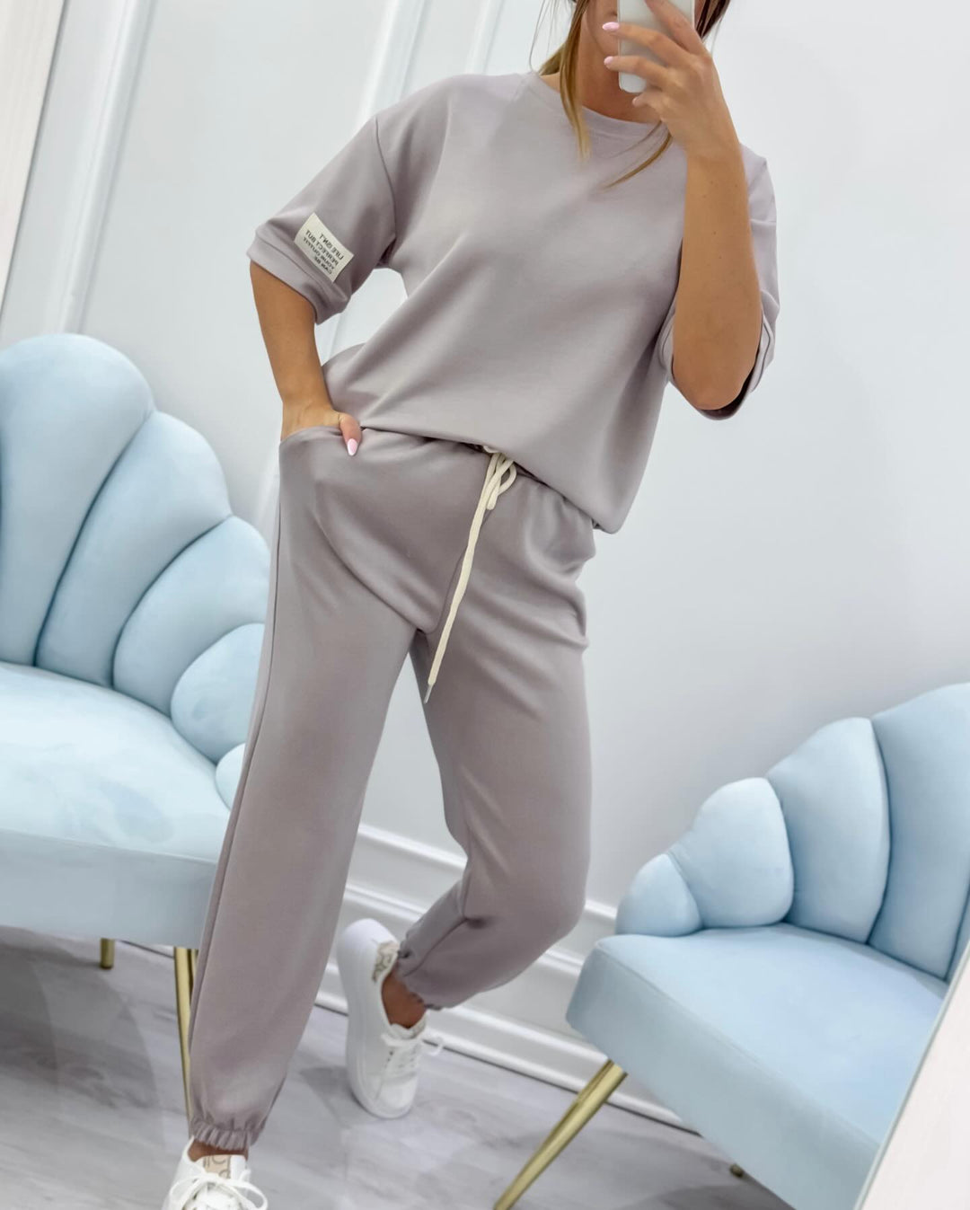 Versatile women's short sleeve top & pant set; stylish for casual wear, comfortable as summer loungewear.