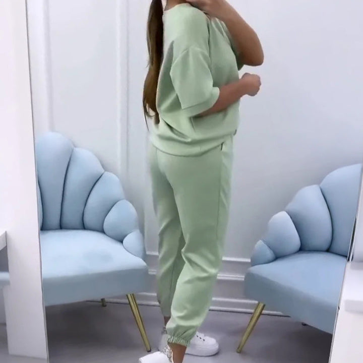Women's short sleeve top & full-length pants set in a stylish, comfortable two-piece design for summer.