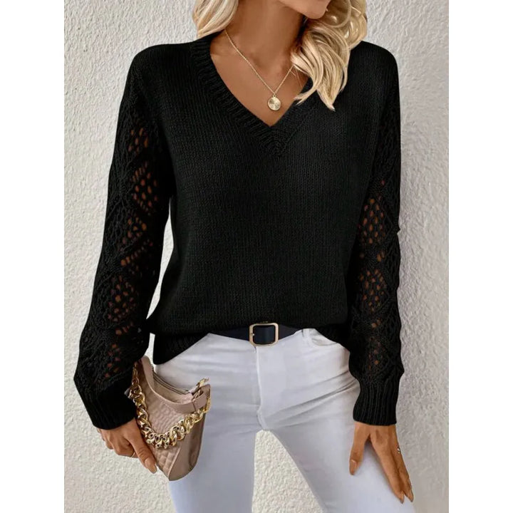 Soft knit women's sweater featuring a chic V-neck and unique open sleeves. Versatile ladies fall fashion top.